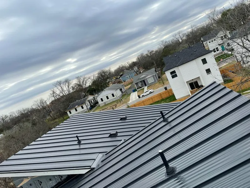 Standing seam metal roof panels with vents for Skylight Repair in Brooklyn